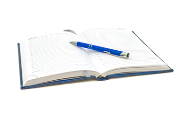 planner and blue pen on a white background