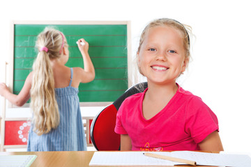 education , girl writing on blackboard