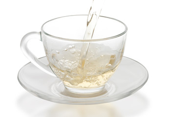 green tea pouring into glass cup
