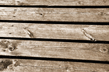 Wooden planks in close up in sepia - background