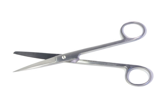 Open surgical scissors at white background