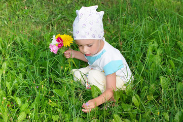 Child picking flowers.
