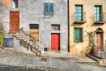 Wooden multicolored doors in the house in Saluzzo.