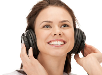 Fototapeta premium happy teenage girl in big headphones