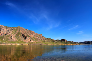 Naklejka premium landscape river, mountain and blue sky
