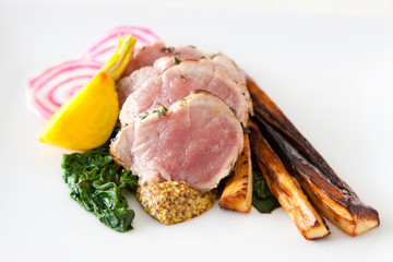 Sliced pork with spinach and parsnips
