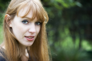 Portrait of Red-haired Woman talking