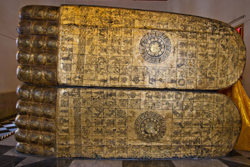 The ancient stone carved the Buddha's footprint