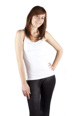 Fototapeta premium The young long-haired girl in a white vest on a grey background