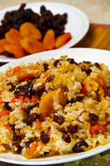 Pilaf made ​​of rice, fresh carrots and dried fruits.
