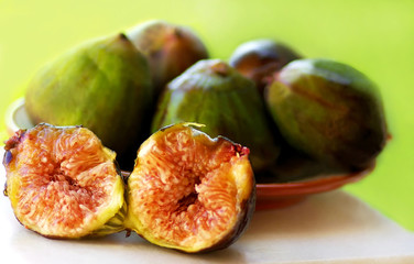Ripe fruits of a fig on green background