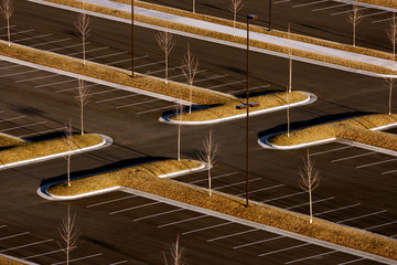 view of parking lot in winter with dividers covered in lawn © Melissa Dockstader