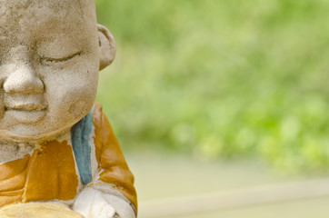 little monk statue