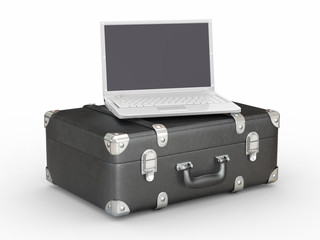 Laptop and suitcase on white isolated background