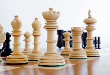 Chess pieces on wood board