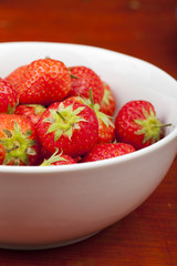 A bowl of strawberries.