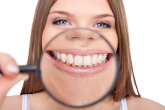 woman showing her healthy teeth