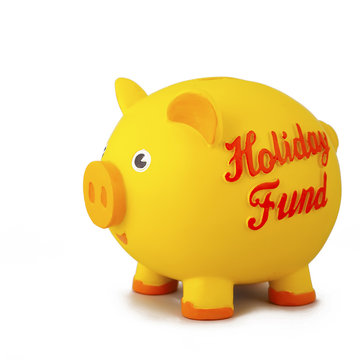 Side view of yellow piggy bank, isolated on white.