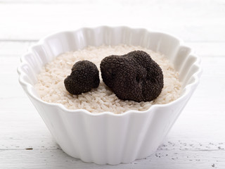 truffle over raw rice on bowl