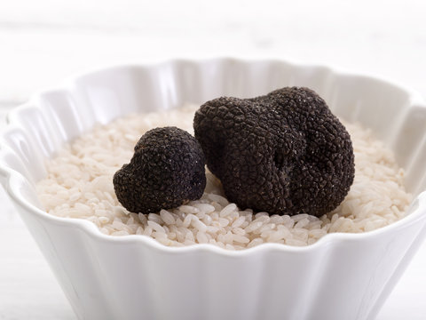truffle over raw rice on bowl