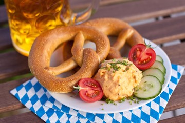 Obazda cheese with pretzel and fresh vegetables