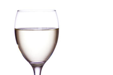 White wine in a glass, white background.