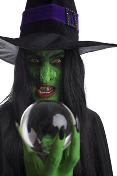 Wicked witch and her crystal ball, white background.
