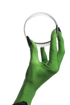 Witch's Hand Holding A Crystal Ball, White Background.