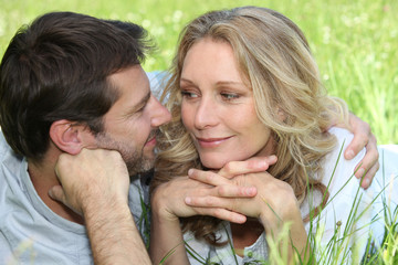 Loving couple embracing in a meadow