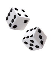 A pair of gambling dices falling down on white background