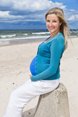 Pregnant woman on beach