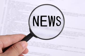 Magnifying glass in hand