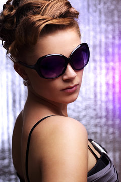 Young stylish woman wearing sunglasses