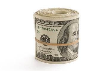 Money roll standing on white