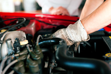Car mechanic in repair shop