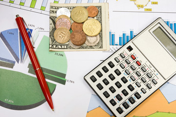 Financial planning using color charts and calculator.