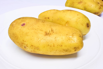fresh potato on wehite plate.JPG