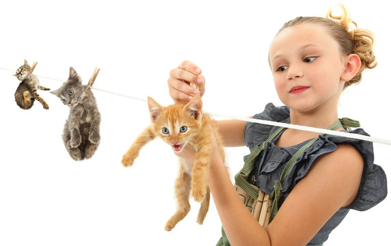 Image Manipulation of Girl Hanging Kittens on Clothes Line