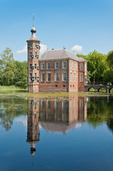 Fototapeta na wymiar An ancient Dutch castle reflected in the pond.