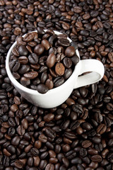 cup of coffee, coffee beans in a ceramic cup.