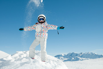 Happy skier playing in snow