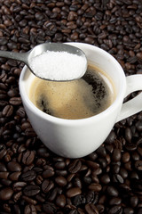 sugar add, espresso coffee and a spoon of sugar add.
