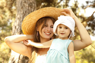 Little girl and mother in the park