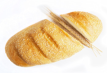 long loaf of bread and wheat ears