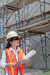 Asian Woman Inspector on construction site.