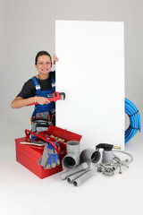 Female labourer surrounded by tools