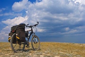 Fototapeta na wymiar touristic bicycle in a steppe