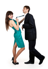 girl holds a businessman in tie