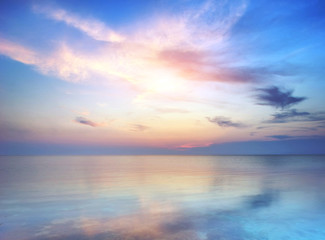 Obraz na płótnie Canvas Sea and rock at the sunset.