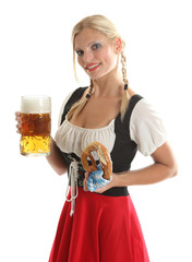 Frau im Dirndl mit Bierkrug und Bretzel
